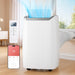 Portable air conditioner with remote control and smartphone app interface in a room with a window.