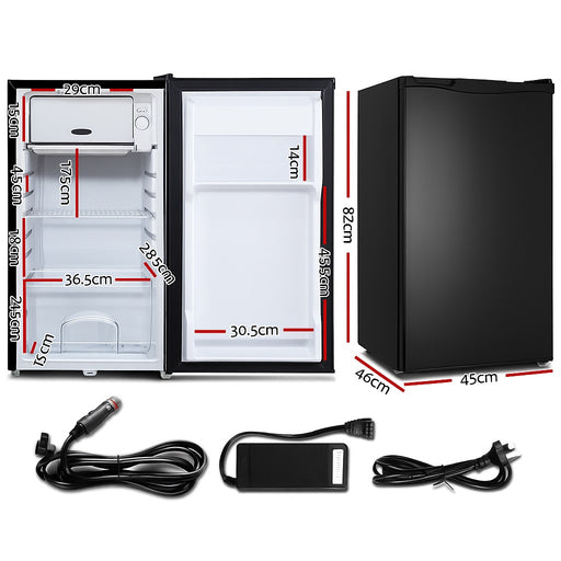 12 Volt black refrigerator with dimensions and power cord on a white background