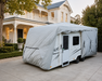 Caravan with cover in front of heritage style home