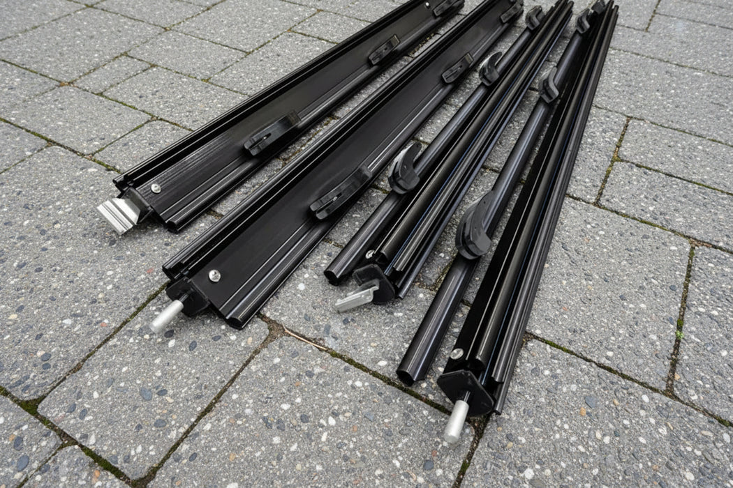Set of components for awning flap eliminator kit