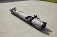 Gray rolled-up mat with black ribbons 