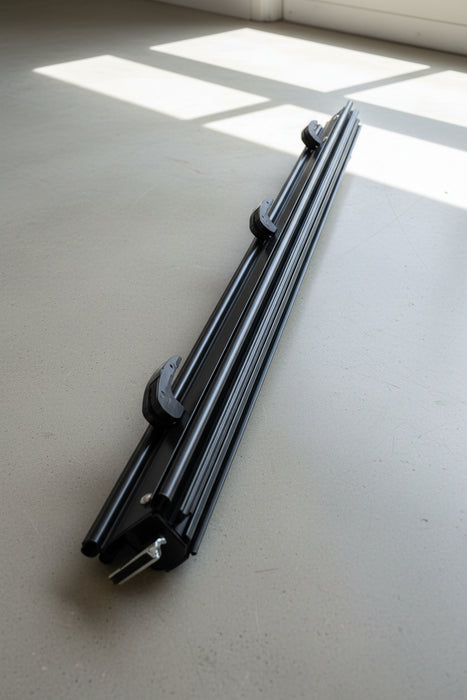 Black metal component for awning flap eliminator kit