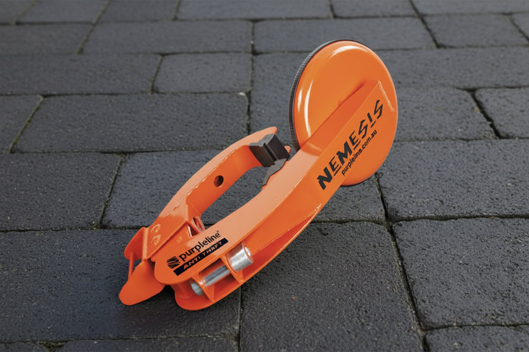 Orange wheel clamp labeled 'Nemesis' 