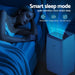 Woman sleeping in a bedroom with a air-conditioner labeled 'Smart sleep mode'.