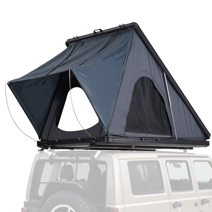 Roof top tent attached to a vehicle on a white background