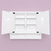 White wall-mounted cabinet with open doors 